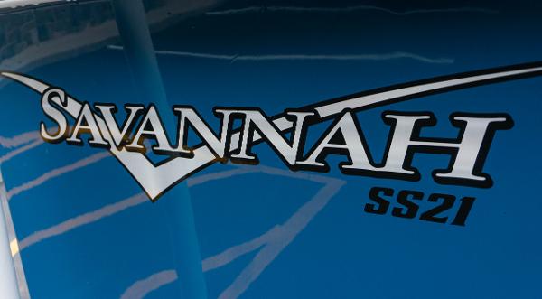 Slide: The Image of 2023 Savannah SS21 logo on blue surface - 15