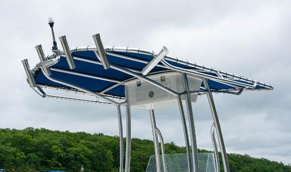 Slide: The Image of 2023 Savannah SS21 boat with blue canopy and rod holders - 3