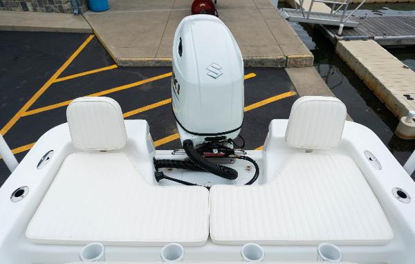 Slide: The Image of 2023 Savannah SS21 boat with outboard motor and white seating. - 9