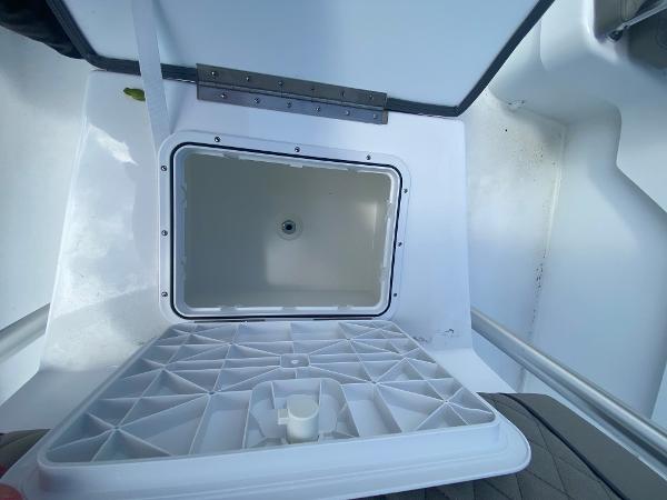Slide: The Image of Open storage compartment of 2024 Savannah SS21 boat. - 12