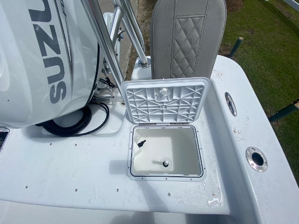 Slide: The Image of Open storage compartment on a 2024 Savannah SS21 boat with Suzuki engine. - 6