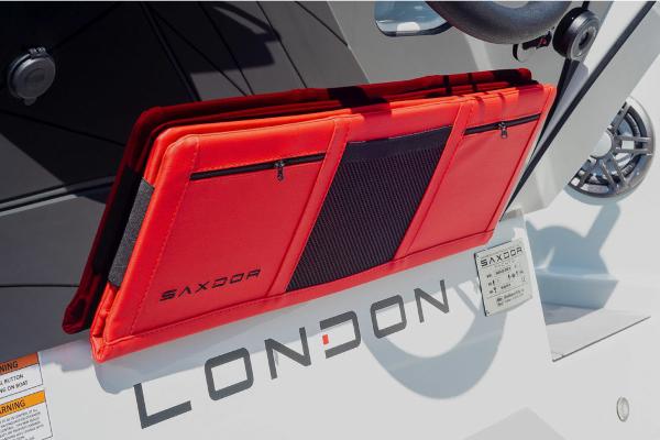 Slide: The Image of Red storage compartment on 2023 Saxdor 200 Pro Sport boat with London text. - 11