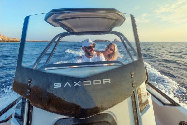 Slide: The Image of Couple enjoying a ride on a 2023 Saxdor 200 Pro Sport boat. - 6