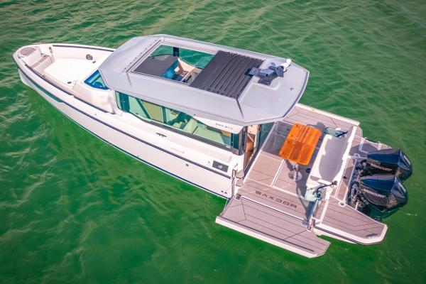 Slide: The Image of 2024 Saxdor 320 GTC boat on water, aerial view. - 13