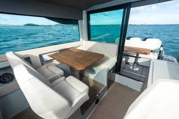 Slide: The Image of Interior of 2024 Saxdor 320 GTC yacht with seating and wooden tables. - 14