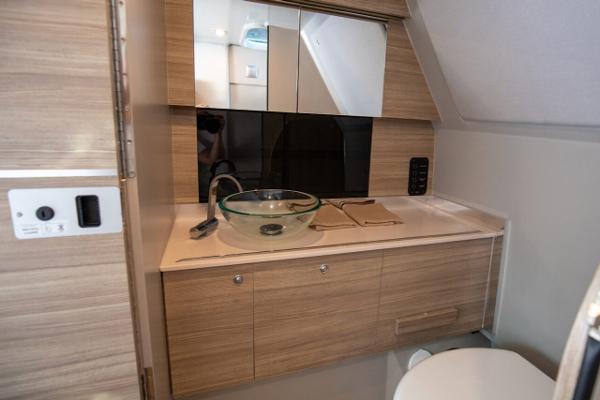 Slide: The Image of Modern bathroom interior of 2024 Saxdor 320 GTC with wooden cabinetry and glass sink. - 15