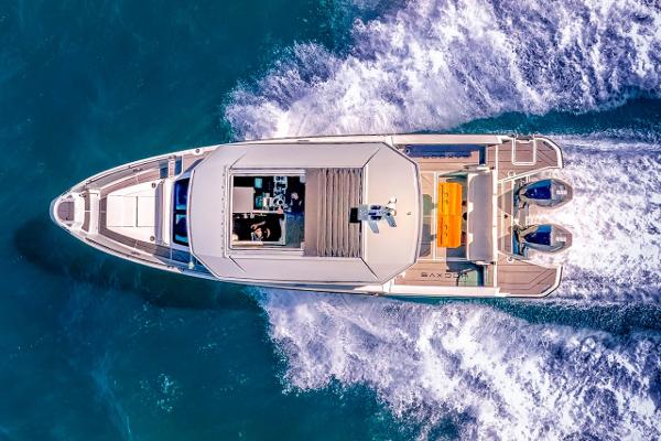 Slide: The Image of Aerial view of 2024 Saxdor 320 GTC yacht cruising on blue water. - 6