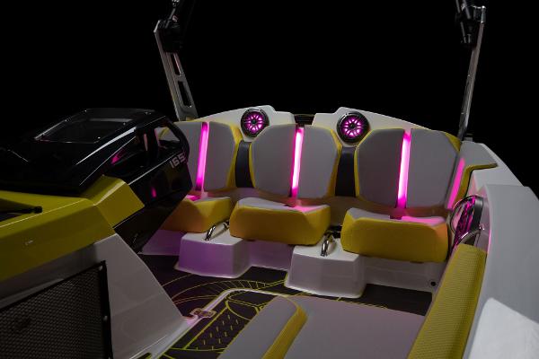 Slide: The Image of 2023 Scarab 165ID boat interior with vibrant LED lighting and modern seating. - 20