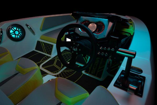 Slide: The Image of 2023 Scarab 165ID boat interior with illuminated dashboard and modern seating. - 21