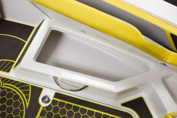 Slide: The Image of 2023 Scarab 165ID boat storage compartment with yellow and black interior design. - 22