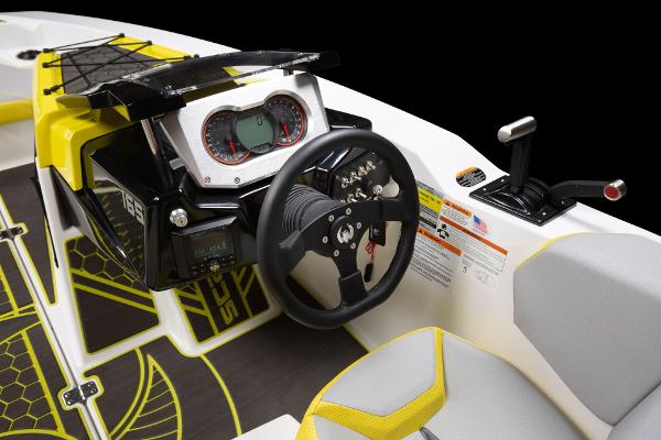 Slide: The Image of 2023 Scarab 165ID boat dashboard and steering wheel close-up. - 25
