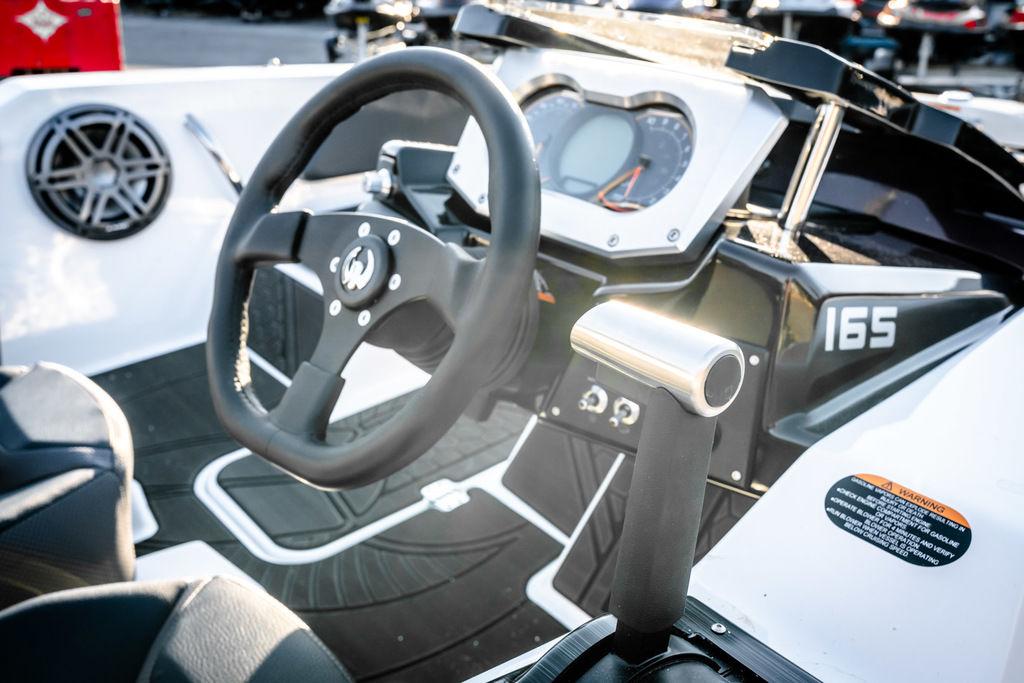 Slide: The Image of 2023 Scarab 165 ID boat dashboard and steering wheel. - 4