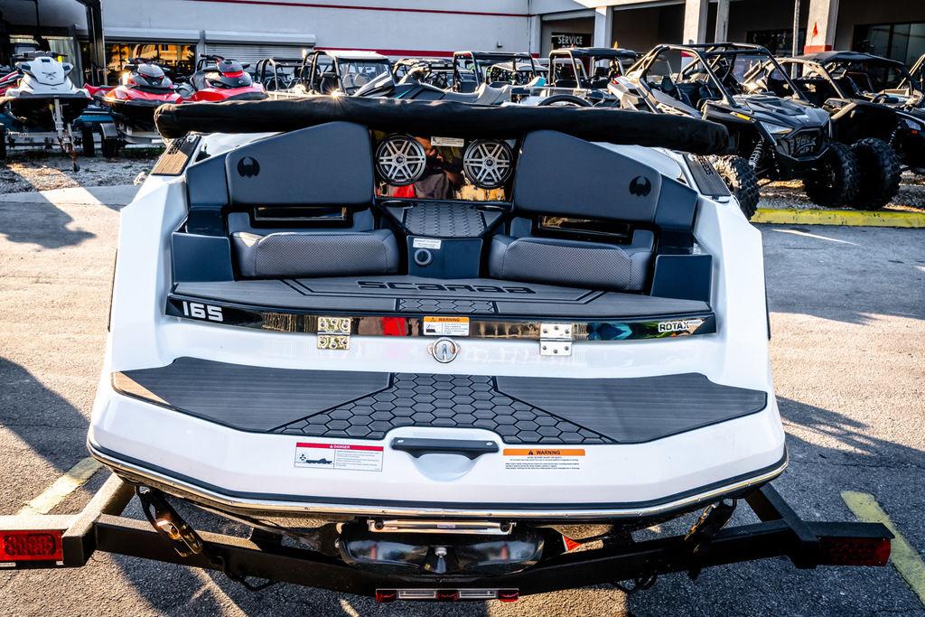 Slide: The Image of 2023 Scarab 165 ID jet boat rear view at dealership. - 8