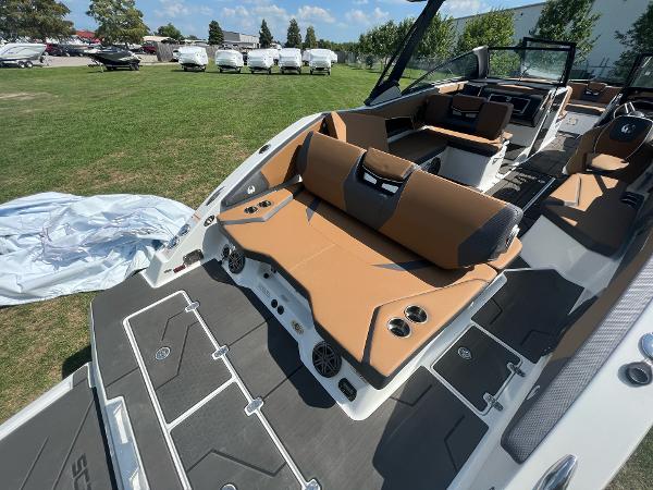Slide: The Image of 2024 Scarab 285 ID boat with tan seating and modern interior design. - 13