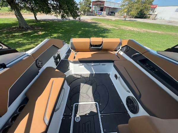 Slide: The Image of 2024 Scarab 285 ID boat interior with brown seating and modern design. - 16