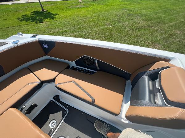 Slide: The Image of 2024 Scarab 285 ID boat interior with tan and black seating. - 19
