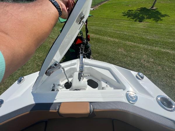 Slide: The Image of 2024 Scarab 285 ID boat anchor compartment with open hatch. - 21