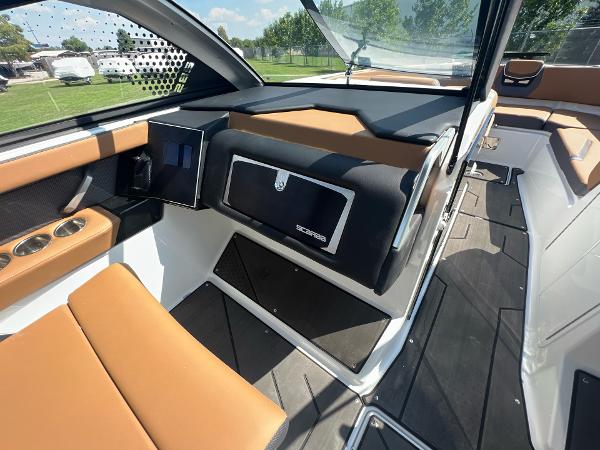 Slide: The Image of 2024 Scarab 285 ID boat interior with tan seating and modern dashboard. - 27