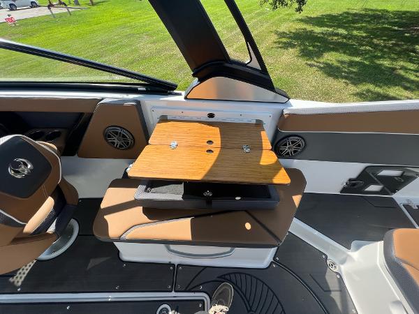 Slide: The Image of 2024 Scarab 285 ID boat interior with seating and table. - 30