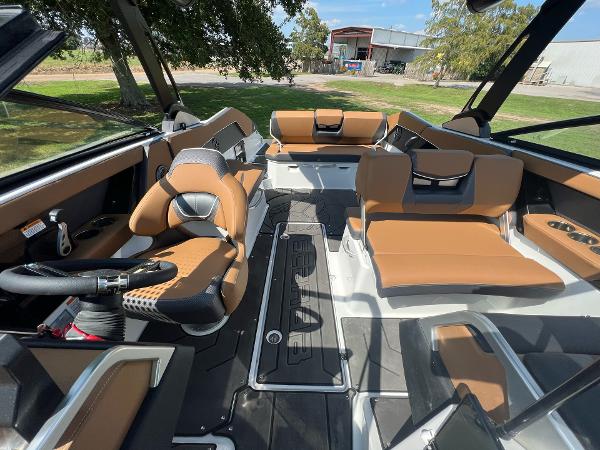 Slide: The Image of 2024 Scarab 285 ID boat interior with tan and black seating. - 36