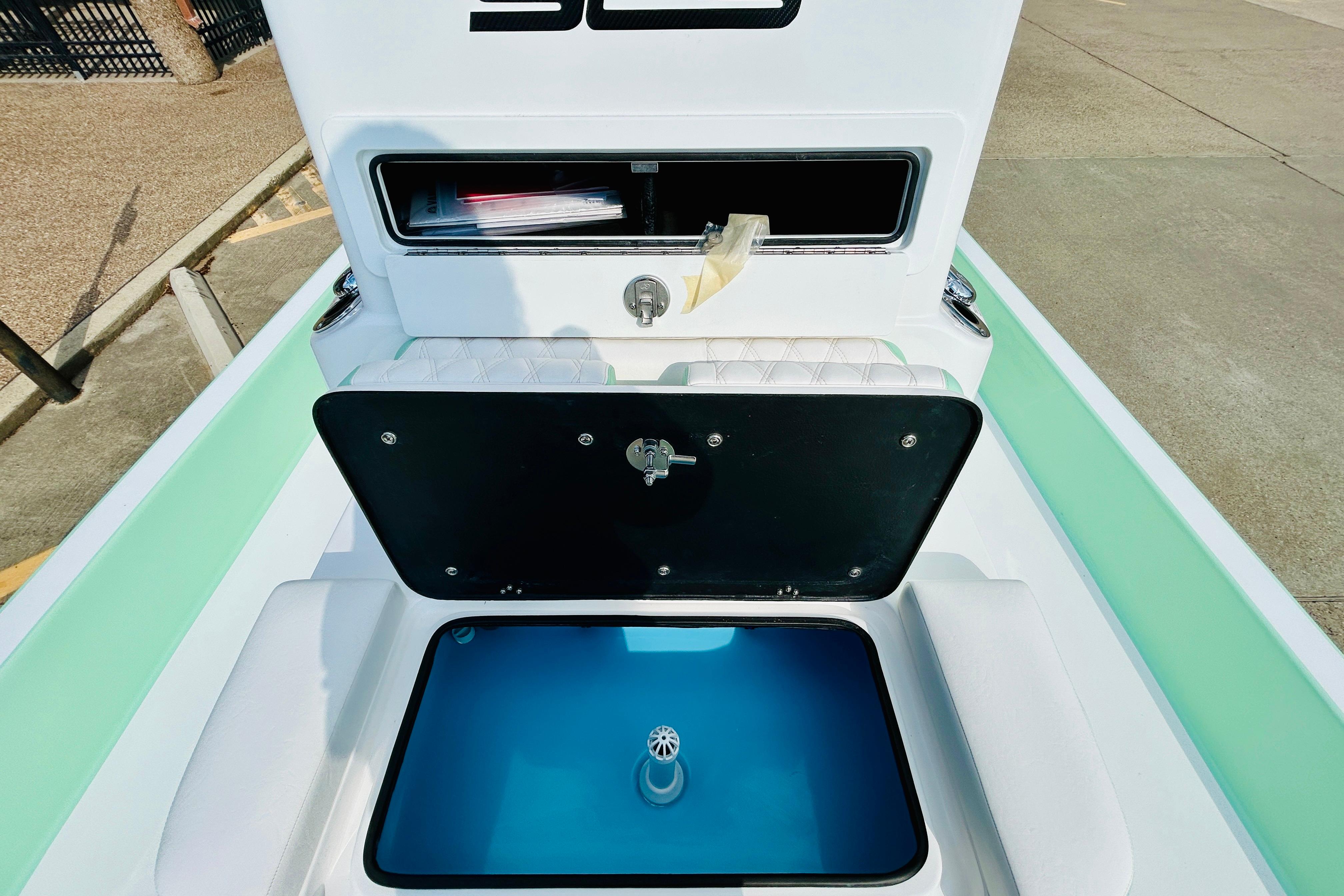 Slide: The Image of 2026 SCB R24 boat interior with storage compartments and seating. - 17