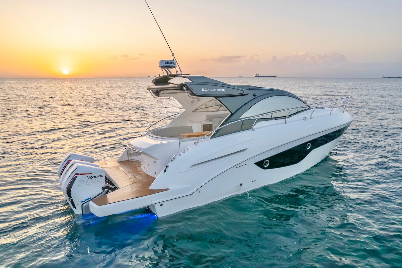 Slide: The Image of 2025 Schaefer 400 Sport yacht at sunset on the ocean. - 10