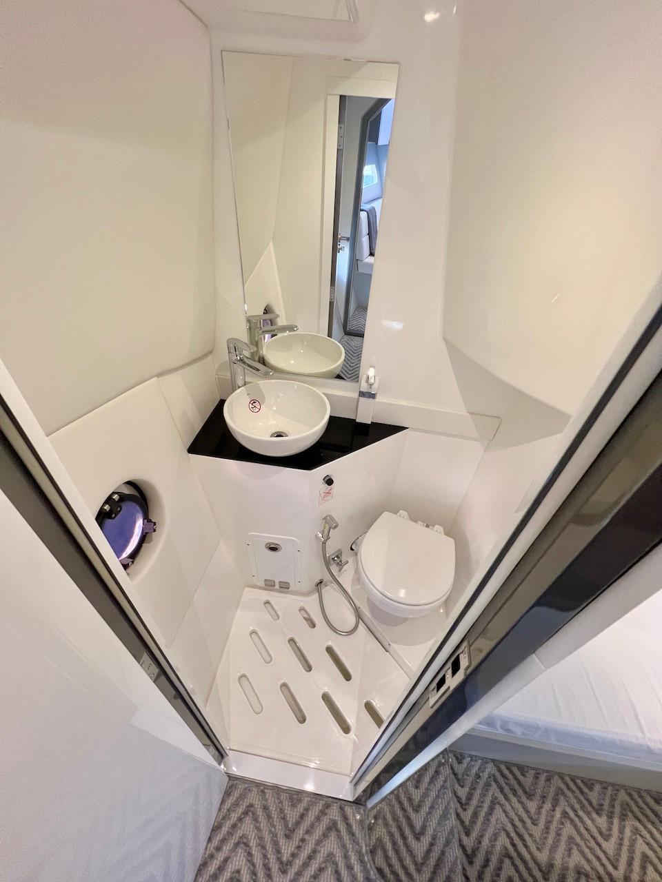 Slide: The Image of Compact bathroom in 2025 Schaefer 400 Sport yacht with modern fixtures and sleek design. - 23