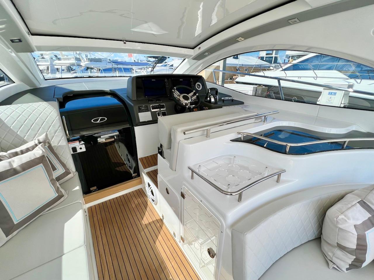 Slide: The Image of Luxurious interior of 2025 Schaefer 400 Sport yacht with modern helm and seating. - 31