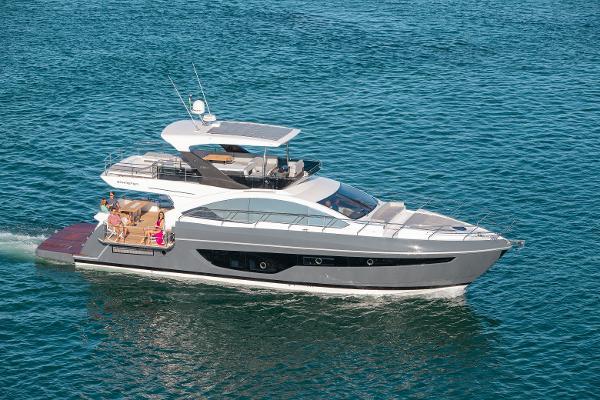 Slide: The Image of 2024 Schaefer 600 luxury yacht cruising on blue ocean water. - 1