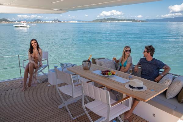 Slide: The Image of People enjoying leisure time on a 2024 Schaefer 600 yacht deck. - 10