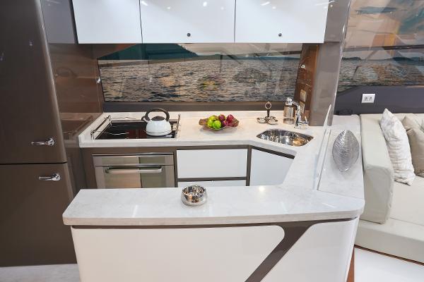 Slide: The Image of Modern kitchen in 2024 Schaefer 600 yacht with sleek countertops and appliances. - 14