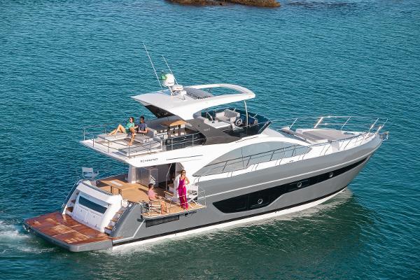 Slide: The Image of 2024 Schaefer 600 yacht cruising on clear blue water. - 2