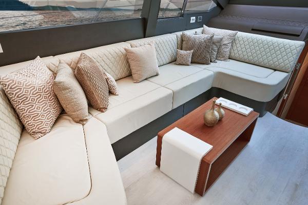 Slide: The Image of Luxurious interior of 2024 Schaefer 600 yacht with plush seating and decorative pillows. - 20
