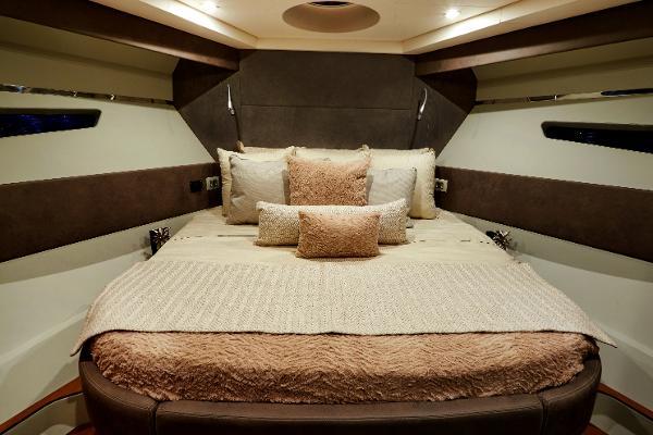Slide: The Image of Luxurious bedroom interior of 2024 Schaefer 600 yacht with plush bedding and ambient lighting. - 22