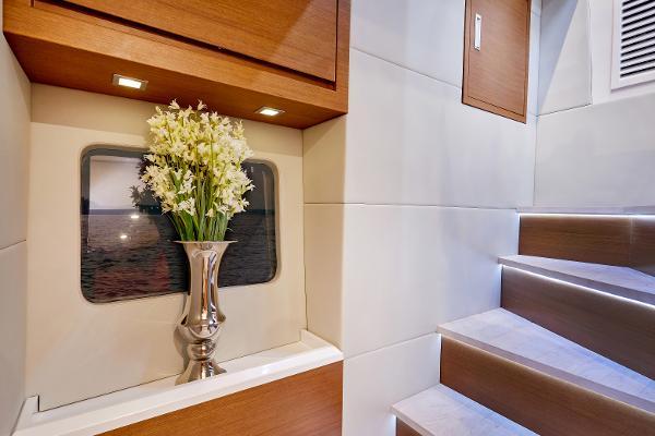 Slide: The Image of Elegant interior of 2024 Schaefer 600 yacht with flower vase and modern staircase. - 23