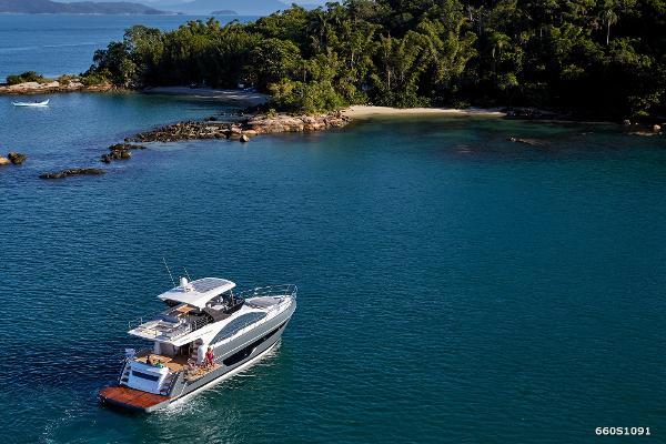 Slide: The Image of 2024 Schaefer 600 yacht cruising near a tropical island. - 4
