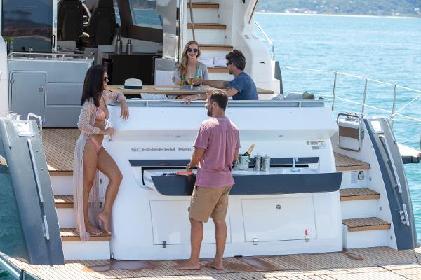 Slide: The Image of People enjoying leisure time on a 2024 Schaefer 600 yacht. - 9