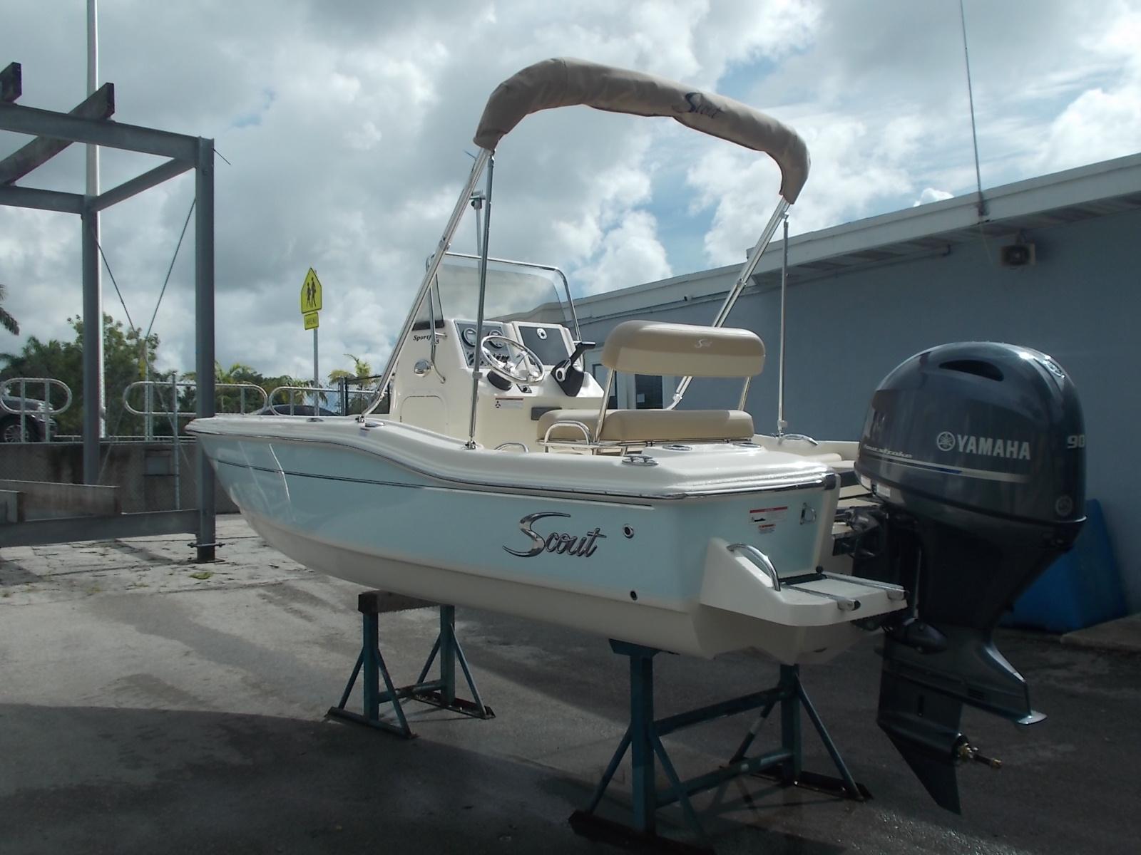 Slide: The Image of 2025 Scout 175 Sportfish boat with Yamaha outboard motor on stands. - 12