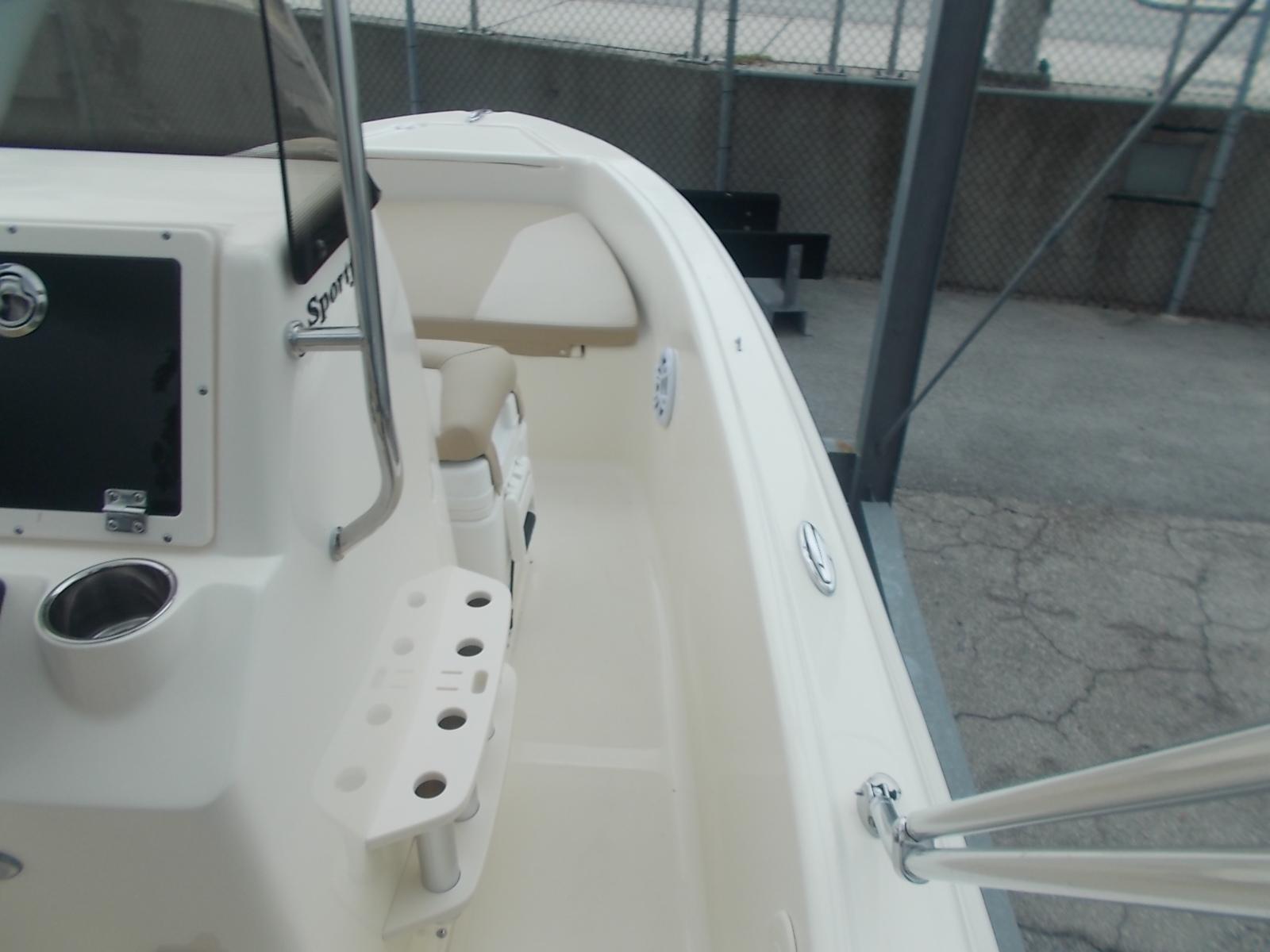 Slide: The Image of 2025 Scout 175 Sportfish boat interior with rod holders and seating. - 5