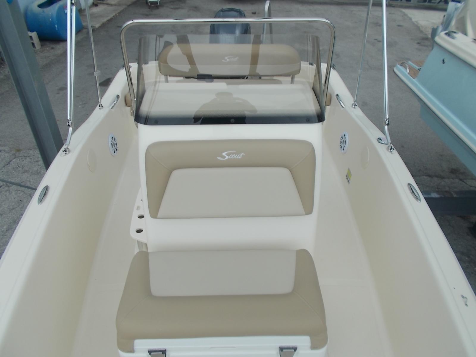 Slide: The Image of 2025 Scout 175 Sportfish boat interior with beige seating and windshield. - 6