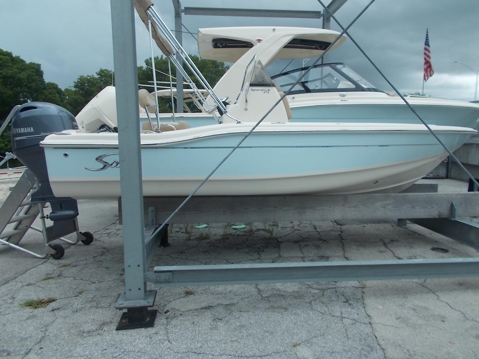 Slide: The Image of 2025 Scout 175 Sportfish boat on a trailer with Yamaha outboard motor. - 9