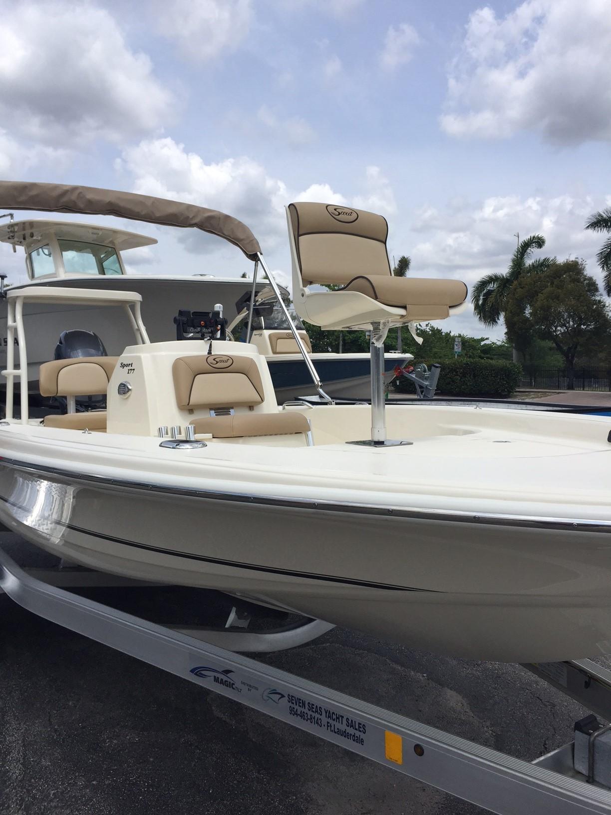 Slide: The Image of 2025 Scout 177 Sport boat on trailer with beige seating and canopy. - 4