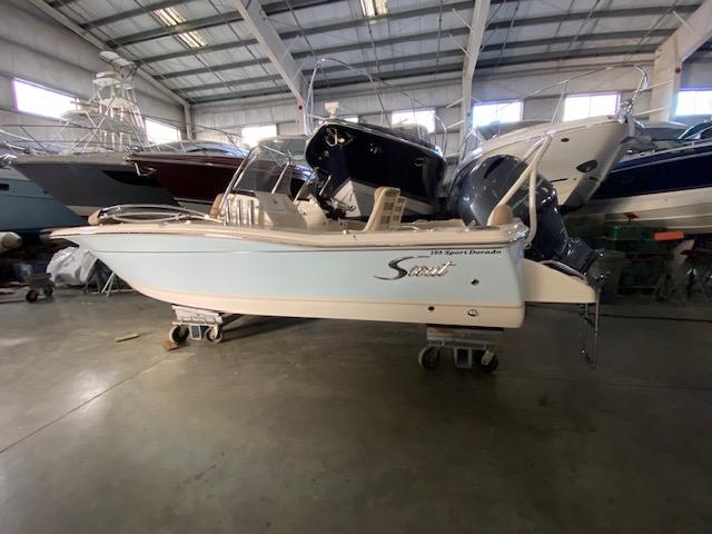 Slide: The Image of 2024 Scout 195 Sport Dorado boat in a showroom. - 0