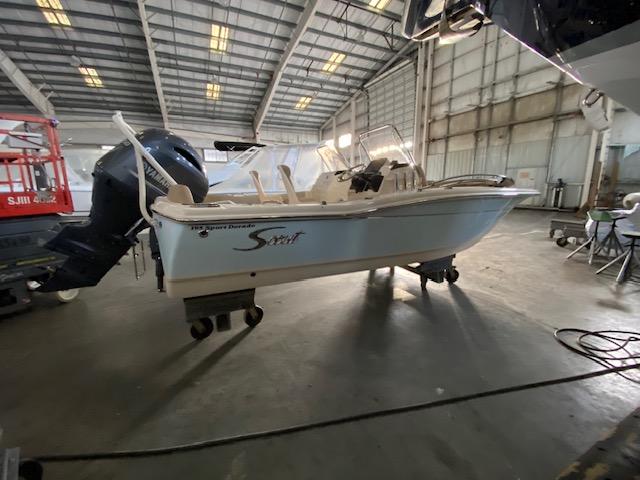 Slide: The Image of 2024 Scout 195 Sport Dorado boat in a warehouse. - 1
