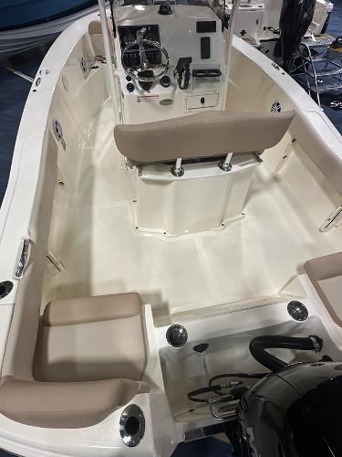 Slide: The Image of 2024 Scout 195 Sportfish boat interior with seating and control panel. - 3