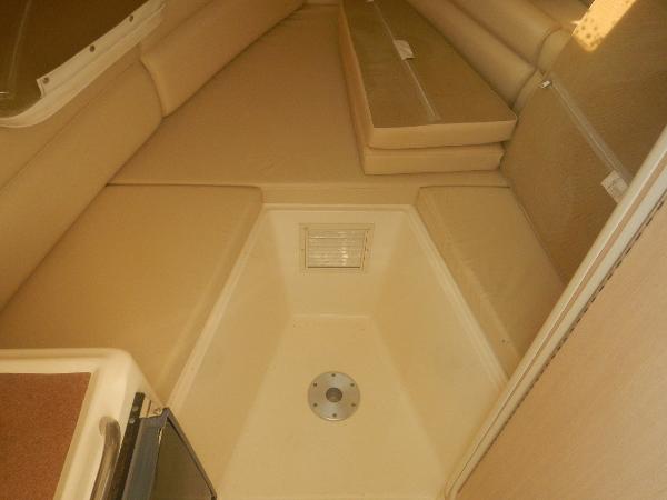 Slide: The Image of 2001 Scout 282 Abaco cabin interior with beige seating and storage. - 14