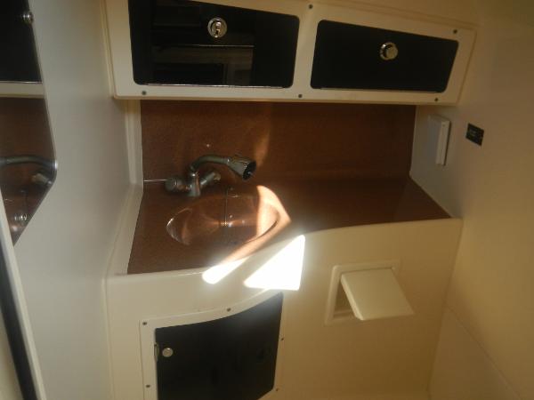 Slide: The Image of 2001 Scout 282 Abaco boat interior with sink and storage cabinets. - 15