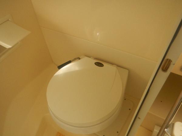 Slide: The Image of 2001 Scout 282 Abaco boat bathroom with compact toilet. - 16