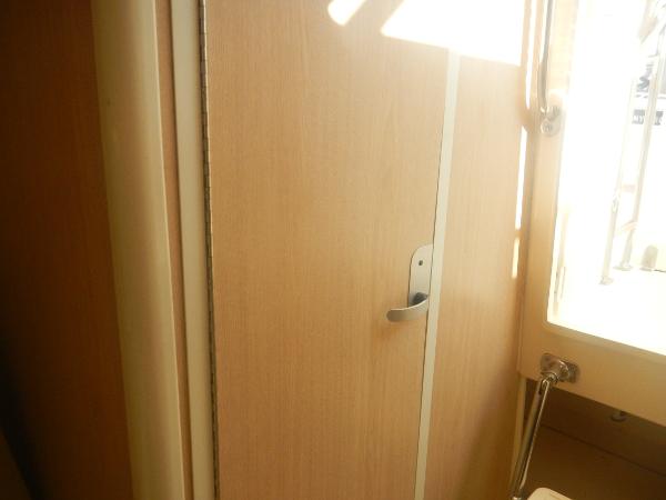 Slide: The Image of Interior view of 2001 Scout 282 Abaco boat, featuring a wooden door and window. - 17