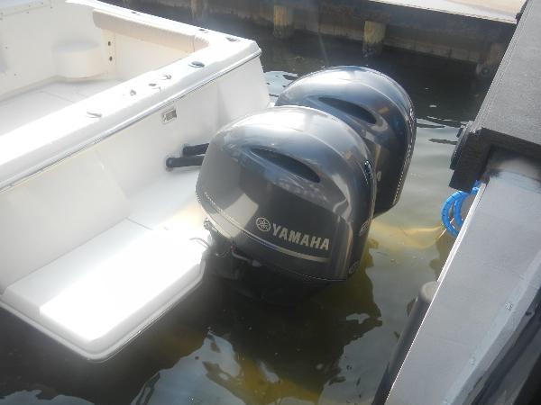 Slide: The Image of Scout 282 Abaco 2001 boat with dual Yamaha outboard motors docked in water. - 26